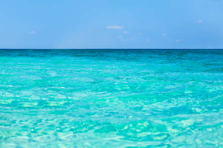 Tropical sea water with bright sun light reflections. Sea backgroundの写真素材