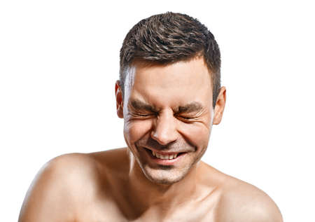 Closeup portrait of happy smiling man isolated on white backgroundの写真素材