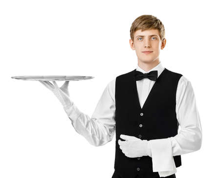 Portrait of young handsome waiter holding empty tray isolated on white backgroundの写真素材
