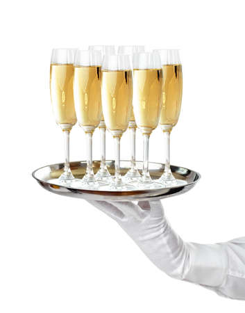Elegant waiter serving champagne on a trayの写真素材