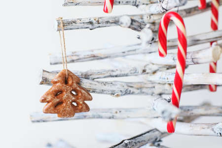 Christmas tree decoration with gingerbread and candy cane isolated on white backgroundの写真素材