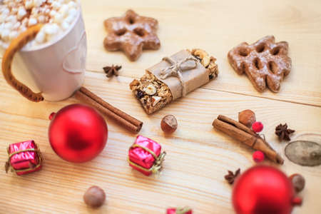 Christmas cookies with festive decoration on wooden background. Top viewの写真素材