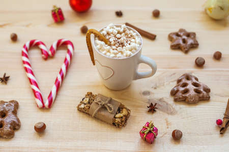 Christmas cookies with festive decoration on wooden background. Top viewの写真素材