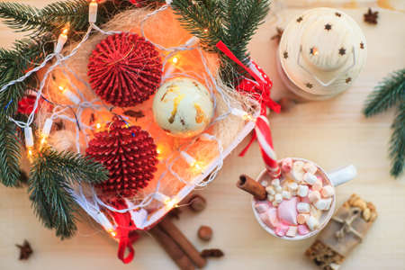 Christmas background with cup of chocolate, marshmallow and festive decoration. Top viewの写真素材