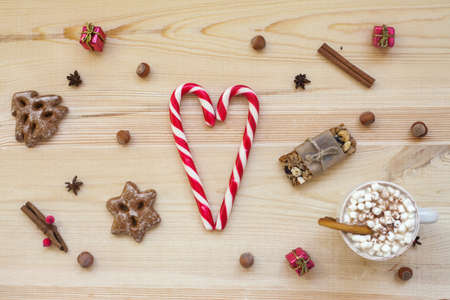 Christmas cookies with festive decoration on wooden background. Top viewの写真素材