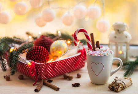 Christmas background with cup of chocolate, marshmallow and festive decoration. Winter holiday conceptの写真素材