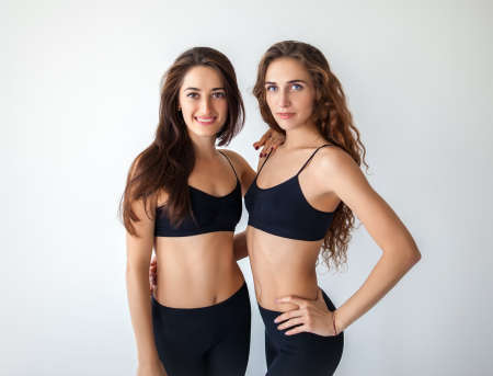 Portrait of two sport young womanの写真素材