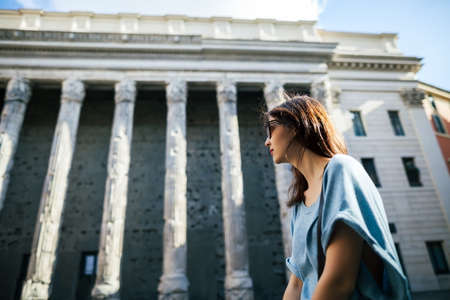 Young beautiful tourist relax in front of the Pantheon in Romeの写真素材