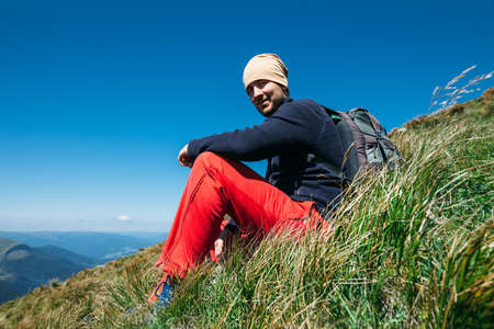 Handsome freedom man relax in mountains.の写真素材