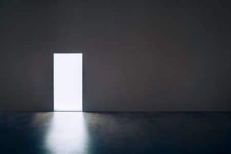 Light door in dark room. Hope conceptの写真素材