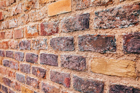 Perspective view of red grunge brick wall backgroundの写真素材