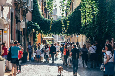 ROME, ITALY - JUNE 3, 2016: Crowd of tourist walking on old town italian streetのeditorial素材