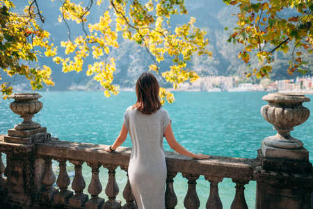 Young woman relaxing on beautiful Garda lake. vacation conceptの写真素材