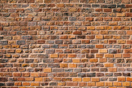 Red grunge brick wall backgroundの写真素材