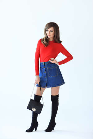 Full length fashion portrait of young beautiful woman in retro style on white backgroundの写真素材