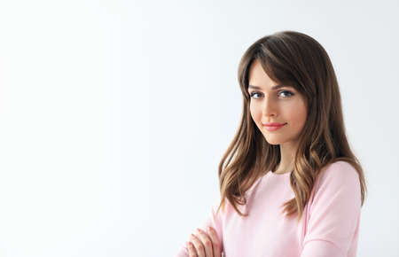 Young beautiful woman portrait with copy space on white background