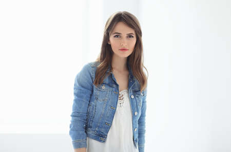 Confident beautiful woman posing on white backgroundの写真素材