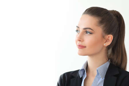 Portrait of young beautiful business woman on white background. Copy spaceの写真素材