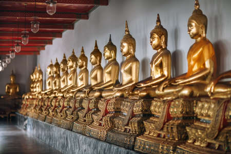 Row of golden buddha statues Bangkok, Thailandの写真素材