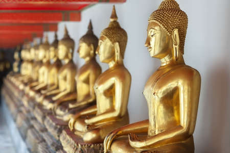Row of golden buddha statues Bangkok, Thailandの写真素材