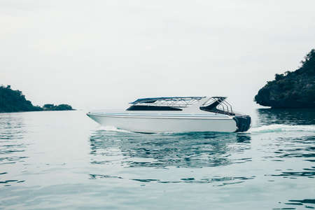 Modern yacht drifting in sea. Luxury vacationの写真素材