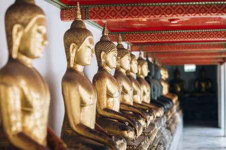Row of Golden Buddha in Thailand, Bangkokの写真素材