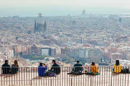 BARCELONA, SPAIN - JANUAR 24, 2017: People watching panorama view of Barcelona on a Bunkers del Carmel on weekendsのeditorial素材