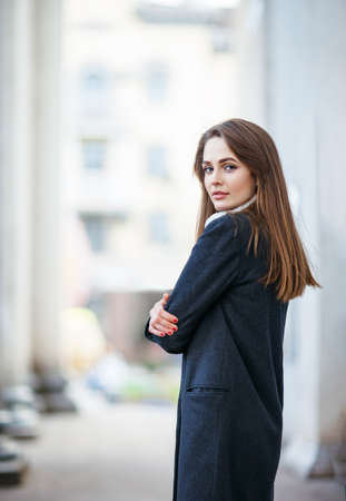 Young beautiful woman posing in city street. Urban lifeの写真素材
