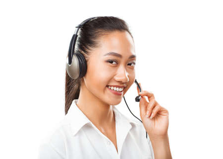 Asian businesswoman with headset - agent, sales manager, service support, operator call center, helpdesk or hot line. Closeup portrait of woman with oriental appearance isolated on white backgroundの写真素材