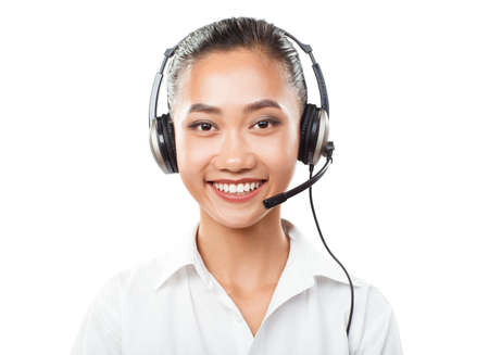 Asian businesswoman with headset - agent, sales manager, service support, operator call center, helpdesk or hot line. Closeup portrait of woman with oriental appearance isolated on white backgroundの写真素材