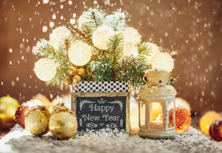 Happy New Year greeting card with baubles, fir and snowの写真素材