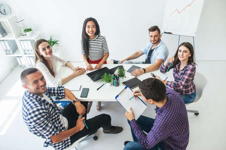 Group of smiling business people working in the office. Top viewの写真素材
