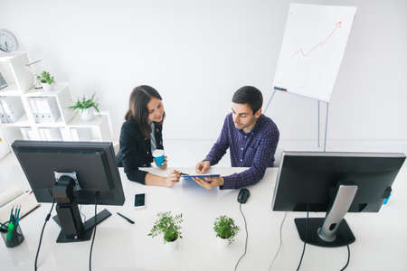 Business people discussing ideas at meeting in the office. Top viewの写真素材