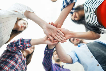 Young business people putting their hands together. Teamwork support together concept
の写真素材
