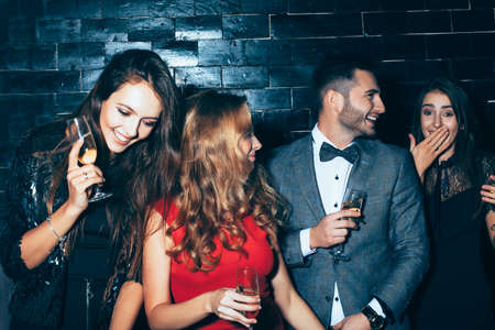 Group of friends enjoying party, having fun and dancing. New year, Birthday, Holiday Event conceptの写真素材
