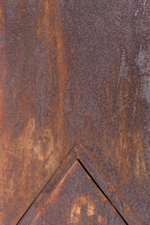 Worn rusty metal texture background. Old iron sheet, door or fence, backdrop. Template for designers and illustrators
の写真素材