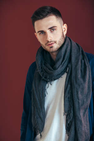 Handsome stylish man on brown background in studio. Beauty conceptの写真素材