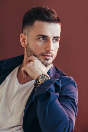 Handsome thoughtful man touching his chin. success conceptの写真素材