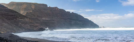 Beautiful panorama of beach Playa De Orzola on Lanzarote, Canary Islands, Spain. Travel destination. Seascape backgroundの写真素材