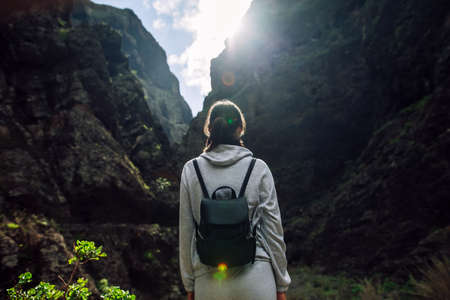 Traveler woman enjoy amazing Masca Gorge landscape during hiking route, Tenerife, Canary Islands. Travel destination. Active vacation conceptの写真素材