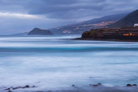 Night view of Garachico cityscape on coast line of Atlantic ocean, Tenerife, Canary islands, Spainの写真素材