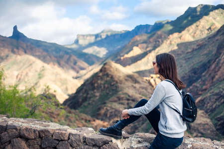 Beautiful woman relaxing on mountains. Vacation conceptの写真素材
