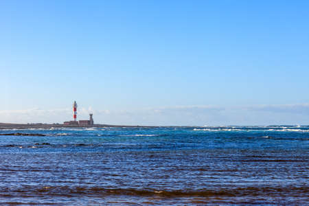 Beautiful ocean landscape with lighthouse in Fuerteventura, Canary islands, Spain. Nature background