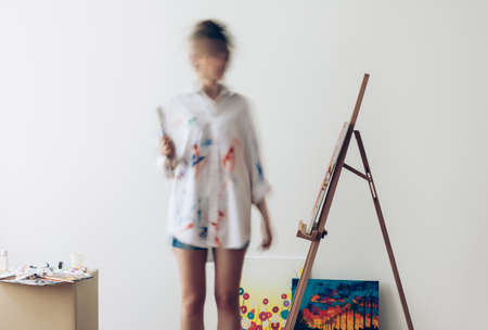 Psychedelic portrait of artist drawing picture. Photo in motion on long exposureの写真素材