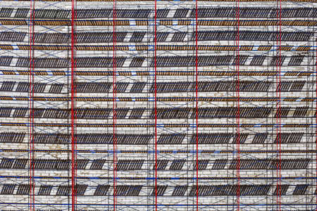 Abstract geometric composition background. Scaffolding on building, metal structures