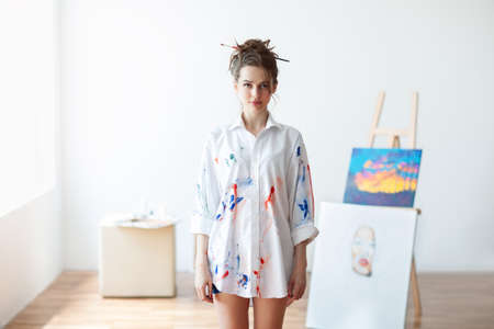 Beautiful woman artist standing in her art studio. Beauty conceptの写真素材