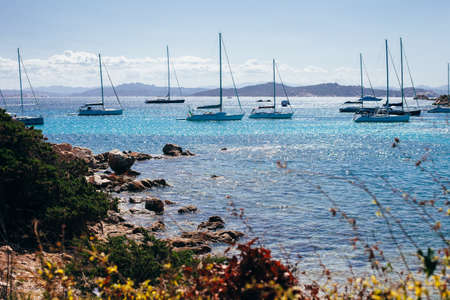 Luxury yachts at the amazing coast of mediterranean sea in Sardinia island, Italy. Summer travel conceptの写真素材