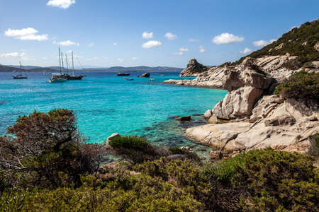Amazing azure clear sea water with yacht in Sardinia island, Italy. Nature backgroundの写真素材