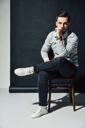 Portrait of handsome thoughtful man touching his chin. Thinking concept               の写真素材