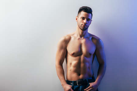 Portrait of a sexy muscular shirtless man with copy spaceの写真素材